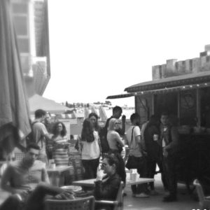 Coffee Circus at University. Crowd drinking coffee near coffee shop